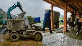 Excavator, car, workers together pour concrete for house foundation