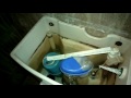 daiso automatic toilet bowl cleaner putting into the toilet bowl tank