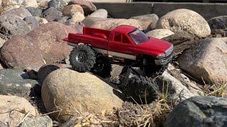 SCX24 Dodge Ram rock crawling through another park.