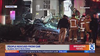 Car slams into side of building, overturns in Pomona