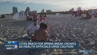 Cities brace for spring break crowds as health officials urge caution