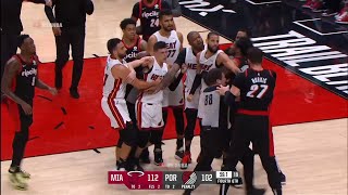 Tyler Herro tries to fight Nurkic by shoving him and then Nurkic punches him in the head