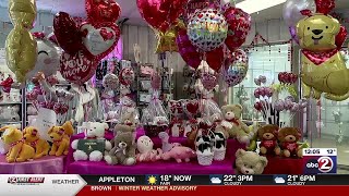 Shoppers picking up beautiful and unique flowers for Valentine’s Day