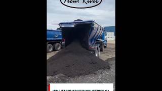 Trout River Live Bottom Trailer unloading asphalt millings and pavings