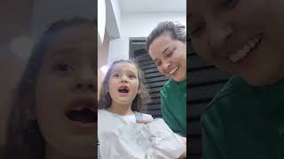 arrancando meu dentinho com minha mãe