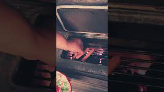 Cooking with a Harman wood stove indoors 🌭