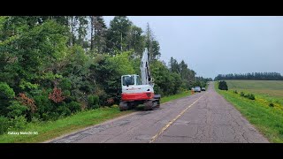 9 ton excavator mulching roadside.  Takeuchi TB290 and FAE mulching head