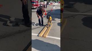 Tiny firefighter shows off impressive strength