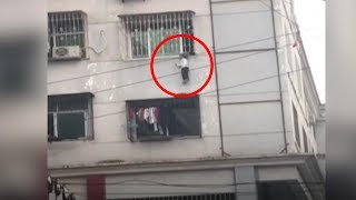 Boy rescued after getting head stuck in window bars midair