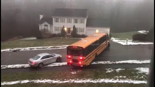 School bus slides down icy road in Massachusetts, crashes into car