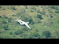 raf airbus a400m atlas making its way through the valleys of the lake district uk.