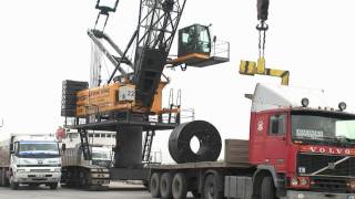 SENNEBOGEN - Port Handling: 6130 HD Crane loading of steel coils on hook , Port Limas