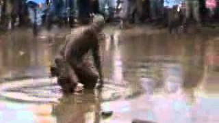 Guy swims in Glastonbury mud.flv