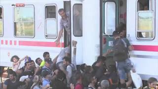 Migrants In Croatian Town Of Ilaca Board Train For Western Europe