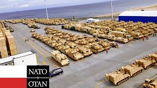Hundreds NATO Military Vehicles Arrive at Poland & Prepare to Head to Ukraine Border