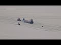 freighter remains stuck in the ice on a frozen lake erie