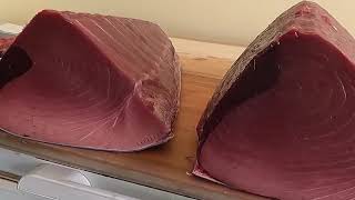 Cutting giant bluefin tuna to luxurious sashimi