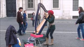 Street artist Harpist plays Yann Tiersen Comptine d'un autre été (cover)