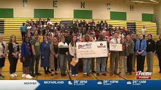 Topeka teacher surprised with award during school assembly