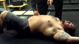 Back Rehab: Dr. Stuart McGill with Brian Carroll - McGill curl -up, with Neuro-muscular pulse
