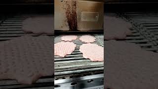 cooking Hardee's charbroil burgers #hardees #carlsjr