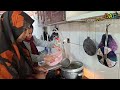 nomadic life mrs. dahl making a hot soup of local vegetables for grandma