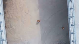 videoblocks aerial top sot of construction workers standing at a highway bridge construction site ht