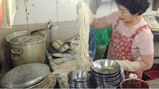 Great Skills. Fast Knife-Cut Noodles. Korea Street Food in Namdaemun Noodle Soup Alley, Seoul