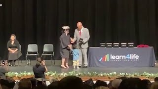 Young mom graduates from San Antonio school that lets students bring children to class