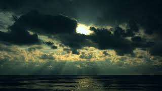 The sun's rays shine through dark clouds Nice view and nice music
