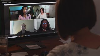 Parents discuss decisions on whether to send children class or do virtual learning