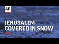 Jerusalem wakes up to a city blanketed in snow