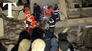 Rescuers search for survivors trapped in rubble after earthquake strikes Turkey and Syria