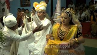 Manipuri bride and groom exchange garlands