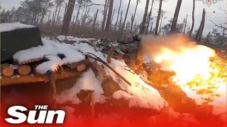 Russian soldiers blast Ukrainian targets from trenches on the frontline
