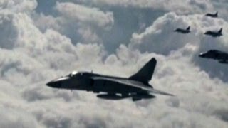 Tensions rise after China flies warplanes over disputed islands