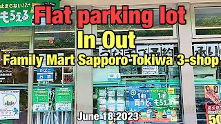 Flat parking lot.In Out.Family Mart Sapporo Tokiwa 3 -jo shop.June 18,2023.Hokkaido,Japan