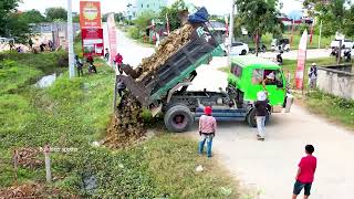 First Dump truck 5T unloading stone Landfilling up and skiller Operator Bulldozer Working push stone