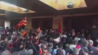 Furious nationalists attack MPs after storming into Macedonian parliament