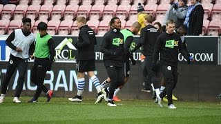 KICK IT OUT - Wigan Athletic players warm up for dedicated Kick It Out game
