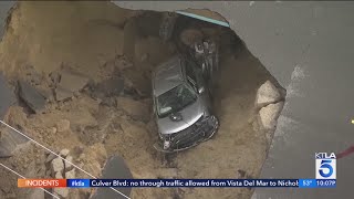 California sinkhole doubles in size after swallowing 2 cars, mother and daughter rescued