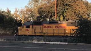 Unoin paecific 1017 is backing to a ￼small train yard in Redding ca.