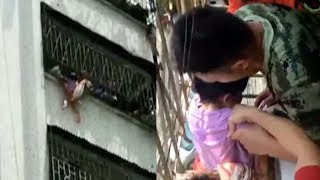 Firefighters save 4 year old girl hanging from 6th floor