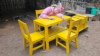 single mother made her own wooden tables and chairs enjoying meals alone without thinking about Hung