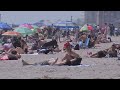 People enjoy summer-like weather from Coney Island