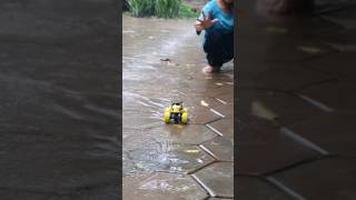 AmretA plays with a small toy car in rain #amreta #automobile #toycarracing #shortsvideo #shorts