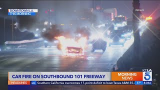 Car catches fire on busy downtown Los Angeles freeway