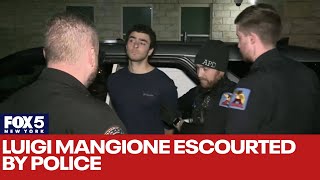 Luigi Mangione escorted by police