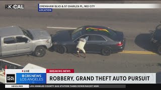 Pursuit suspect somersaults out of car after getting pinned in by Good Samaritan
