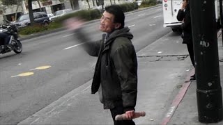 Schizophrenic Homeless Man Shouting and Slapping Himself at the Bus Stop